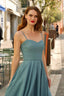 A laughing redhead in Cannes wearing a blue cotton/linen Gaâla Bardot dress, playfully lifting up the skirt to show a voluminous petticoat underneath.